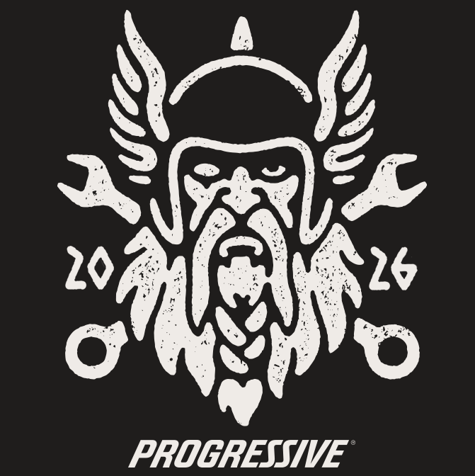 White graphic logo for the 2026 Valhalla Custom Motorcycle Builders Challenge showing a winged Viking helmeted figure with a long beard, crossed wrenches, the numbers 20 and 26, and the Progressive wordmark beneath.